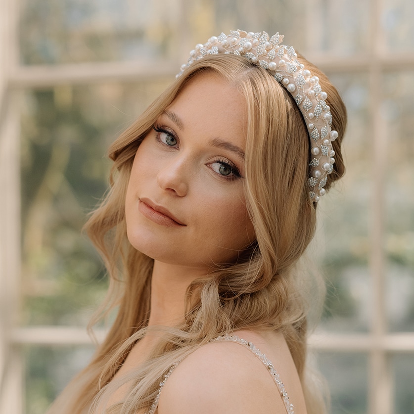 Soft nude beige bridal headband featuring crystal leaves and pearl accents wedding hair accessories