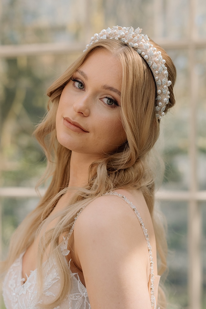 Soft nude beige bridal headband featuring crystal leaves and pearl accents wedding hair accessories