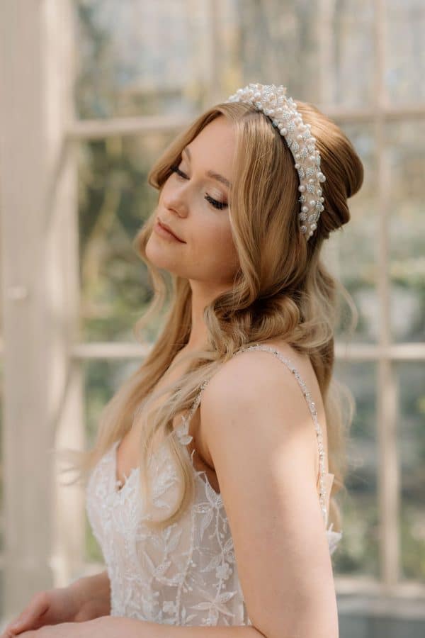 Soft nude beige bridal headband featuring crystal leaves and pearl accents wedding hair accessories